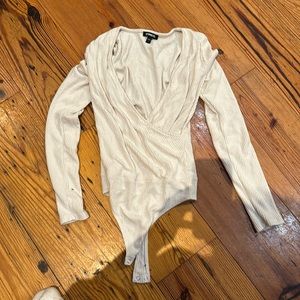 One piece ribbed, express, small neck button in the crotch